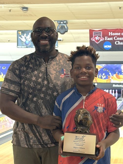 Magnus Williams holding his USBC Youth Open Eagle award